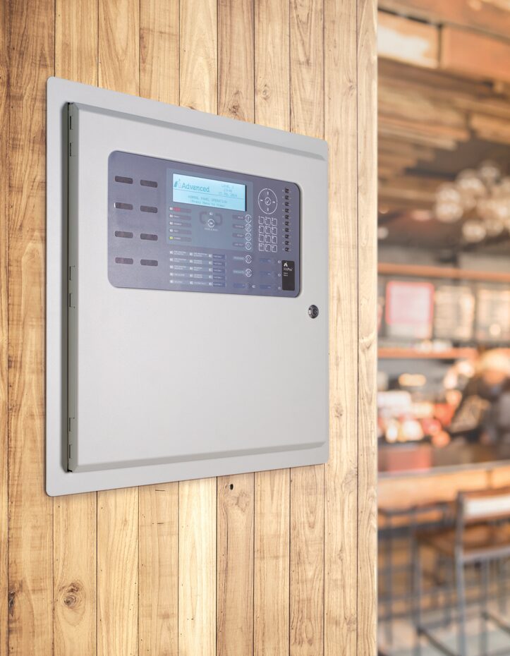 A fire alarm panel installed in a cafe
